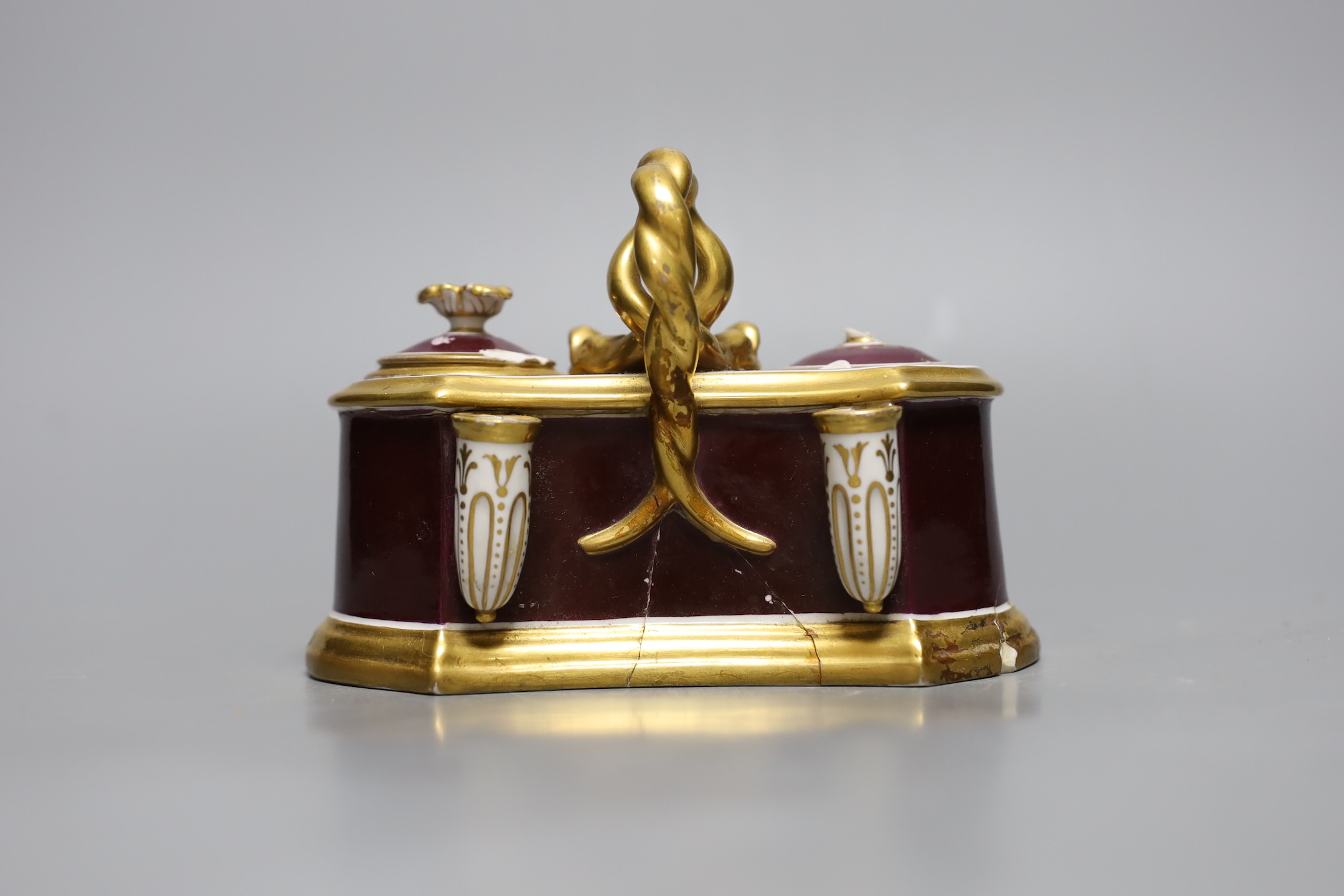 A Flight Barr and Barr ink stand painted with ‘Scene on the banks of Keswick Lake, the handle with serpent heads, printed mark in red, 16 cms wide